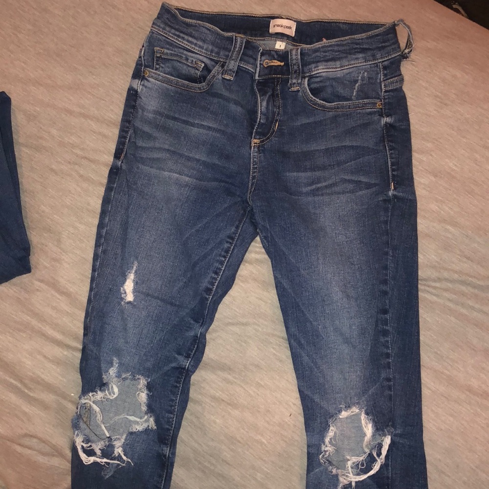 Ripped sneak peak jeans